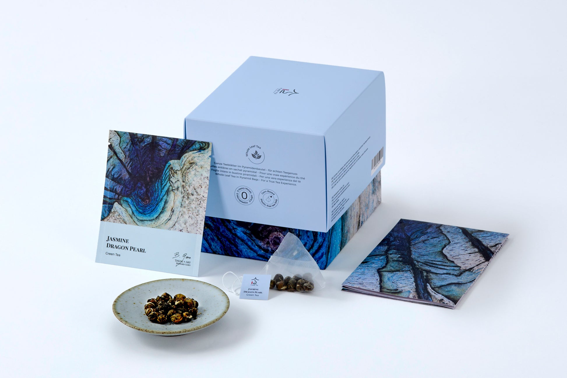 Jasmine Green Tea box, tea sachet, and loose tea pearls from Tingyu x Art by Bernard Garo