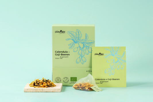 Calendula and Goji tea box, tea sachet, and loose ingredients by HerbalWell